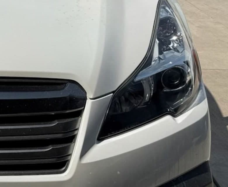 Cloudy oxidized headlight on the same Subaru before restoration